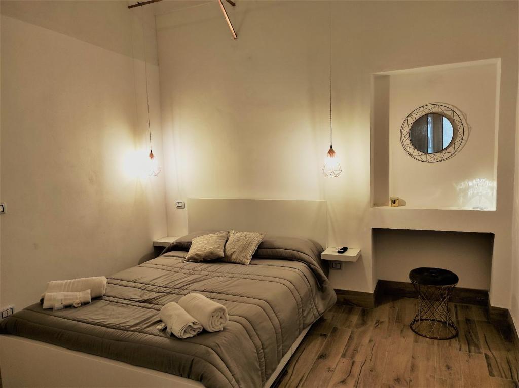 מיטה או מיטות בחדר ב-Athena Apartment- Ortigia Holidays