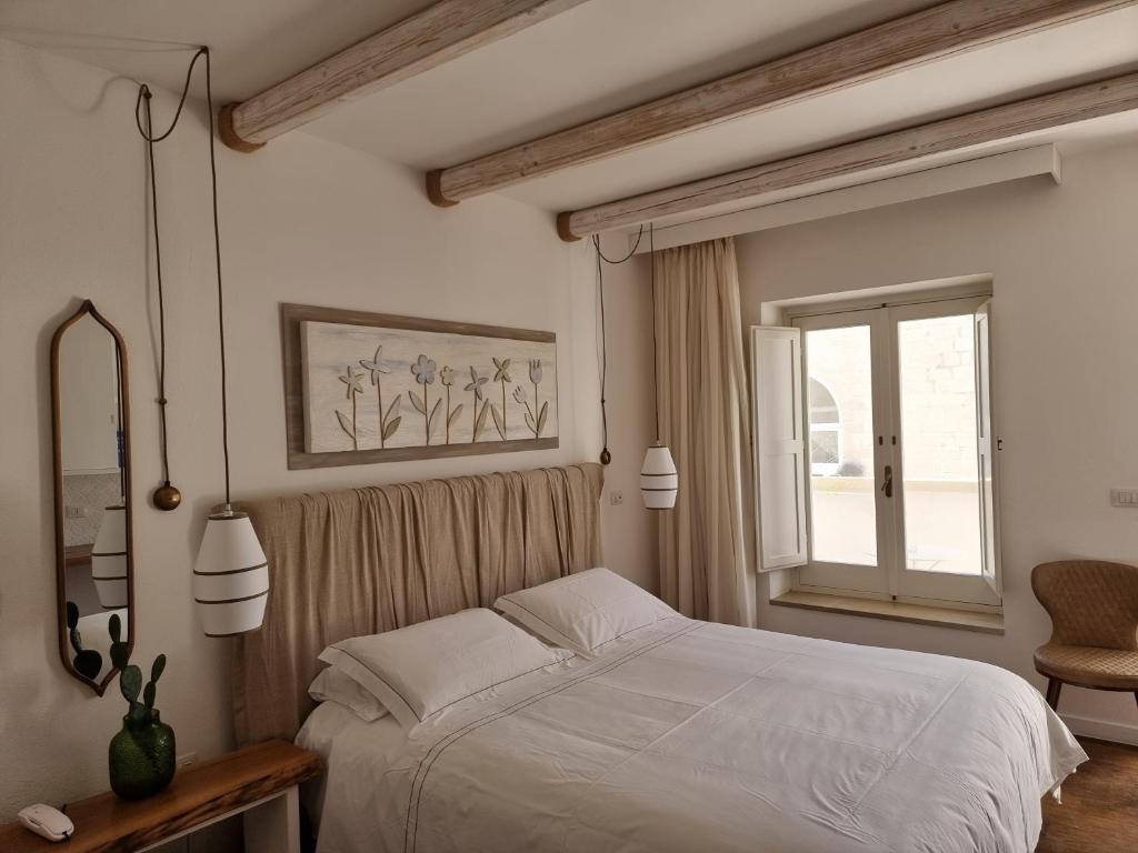 Postel nebo postele na pokoji v ubytování Masseria Bandino & Spa