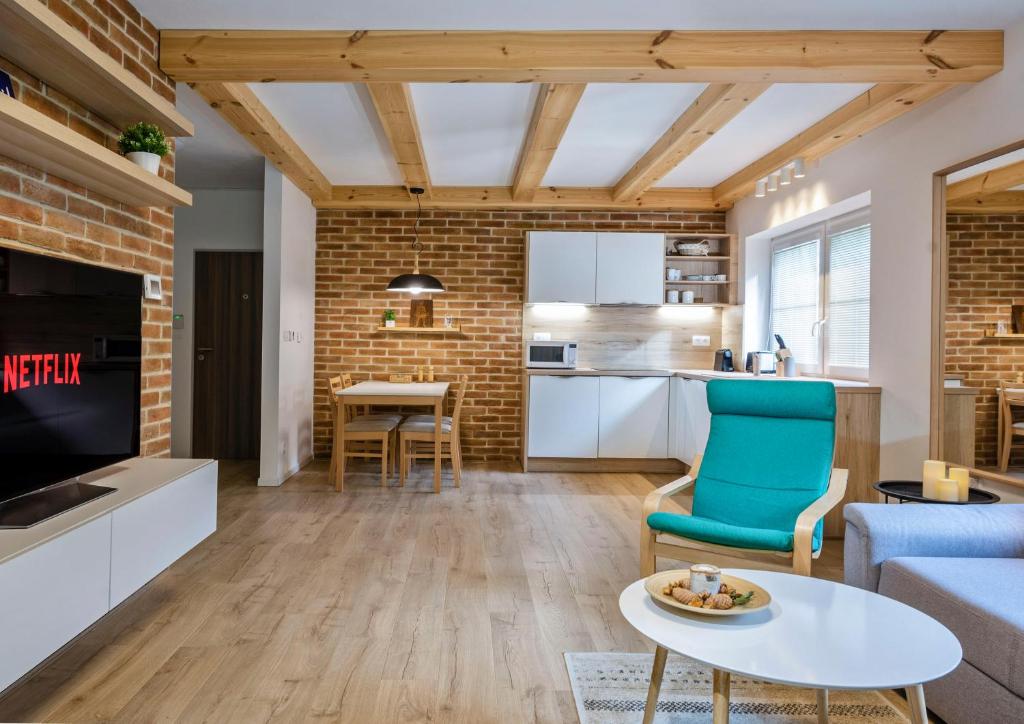 a living room with a couch and a table at Apartmán Vrátna in Terchová