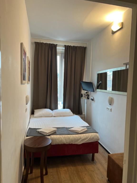 Postel nebo postele na pokoji v ubytování MAX Hotel Amsterdam