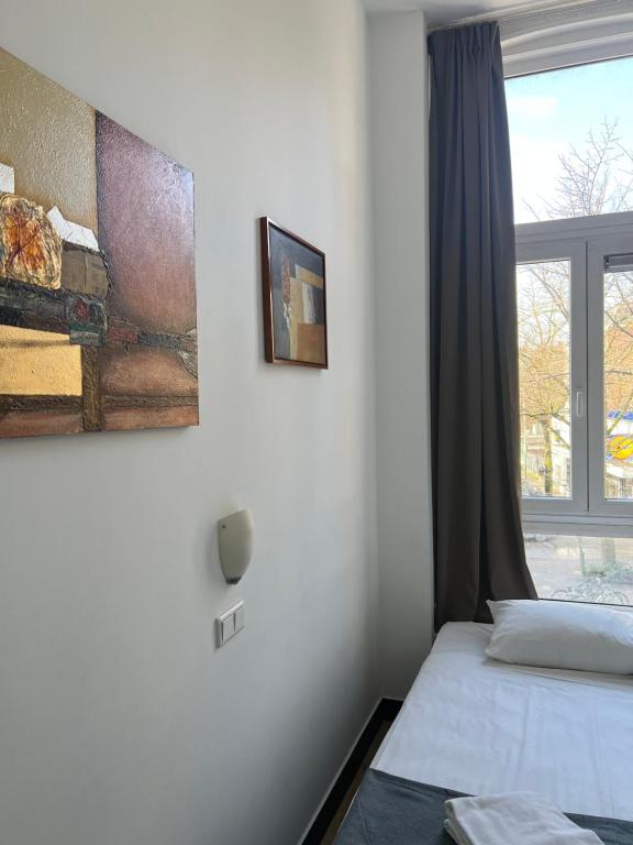Postel nebo postele na pokoji v ubytování MAX Hotel Amsterdam