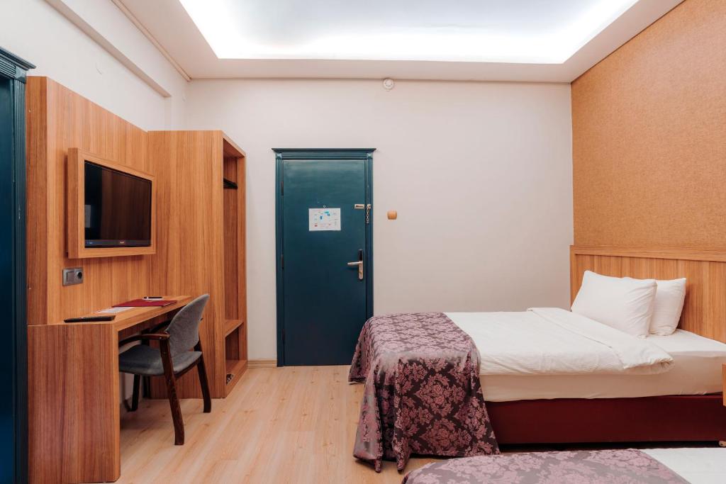 Кровать или кровати в номере Aksular Hotel