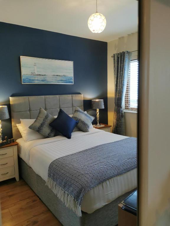 Postel nebo postele na pokoji v ubytování Ocean Heights B&B