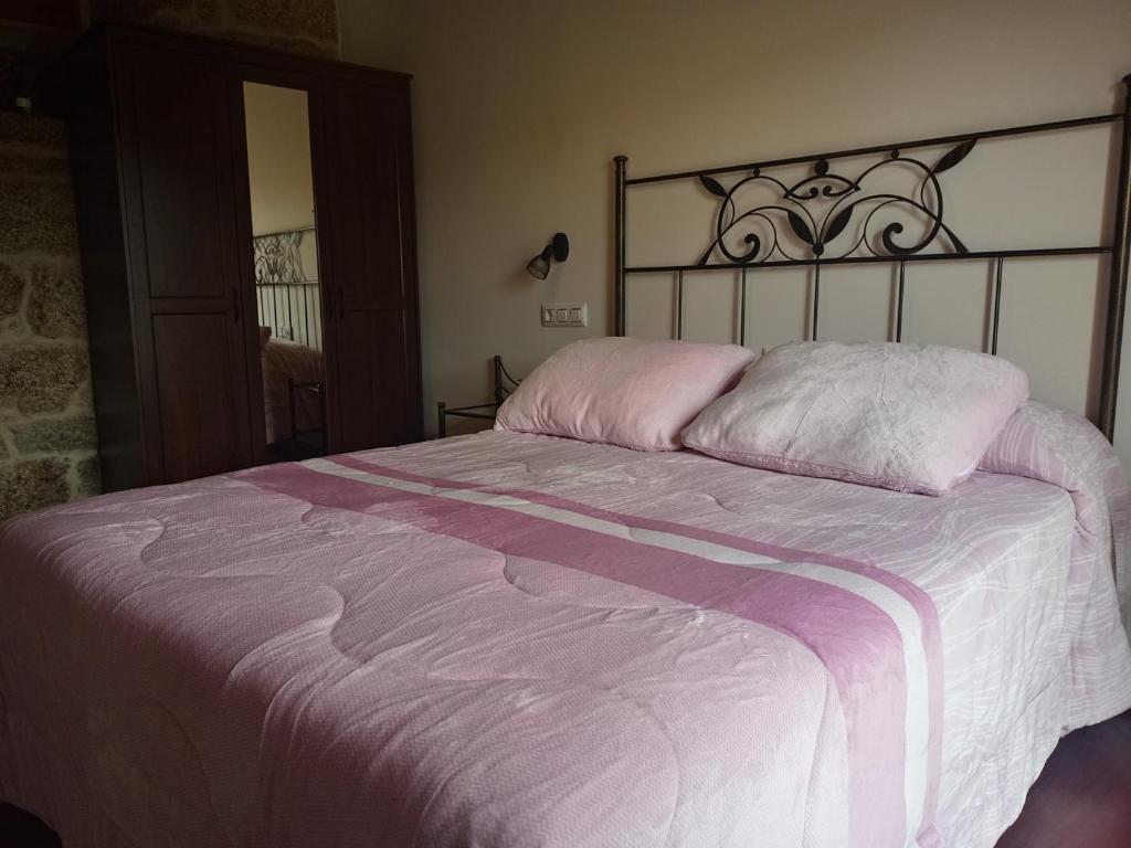 Postel nebo postele na pokoji v ubytování Vivienda Turística A Petada de San Clodio