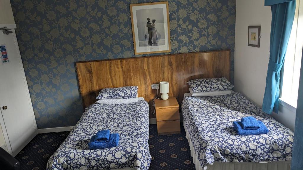 Postel nebo postele na pokoji v ubytování Dalgair House Hotel