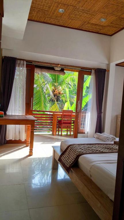 Postel nebo postele na pokoji v ubytování Ubud Dream