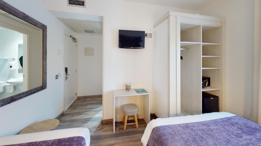 Posteľ alebo postele v izbe v ubytovaní Hotel Bella Dolores