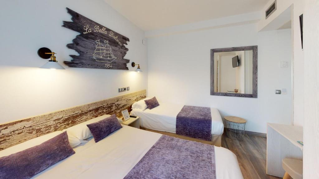 Posteľ alebo postele v izbe v ubytovaní Hotel Bella Dolores
