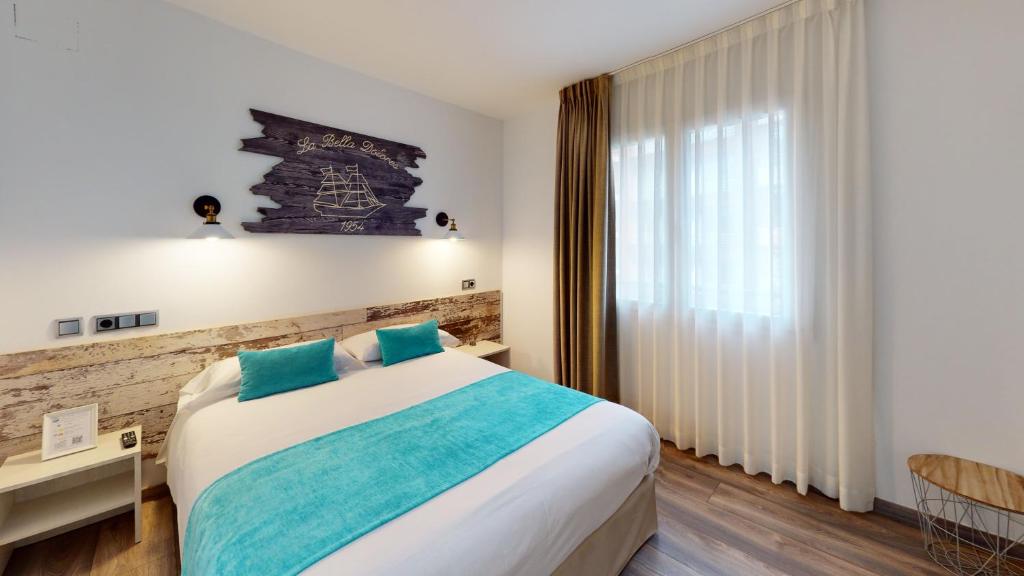 Posteľ alebo postele v izbe v ubytovaní Hotel Bella Dolores