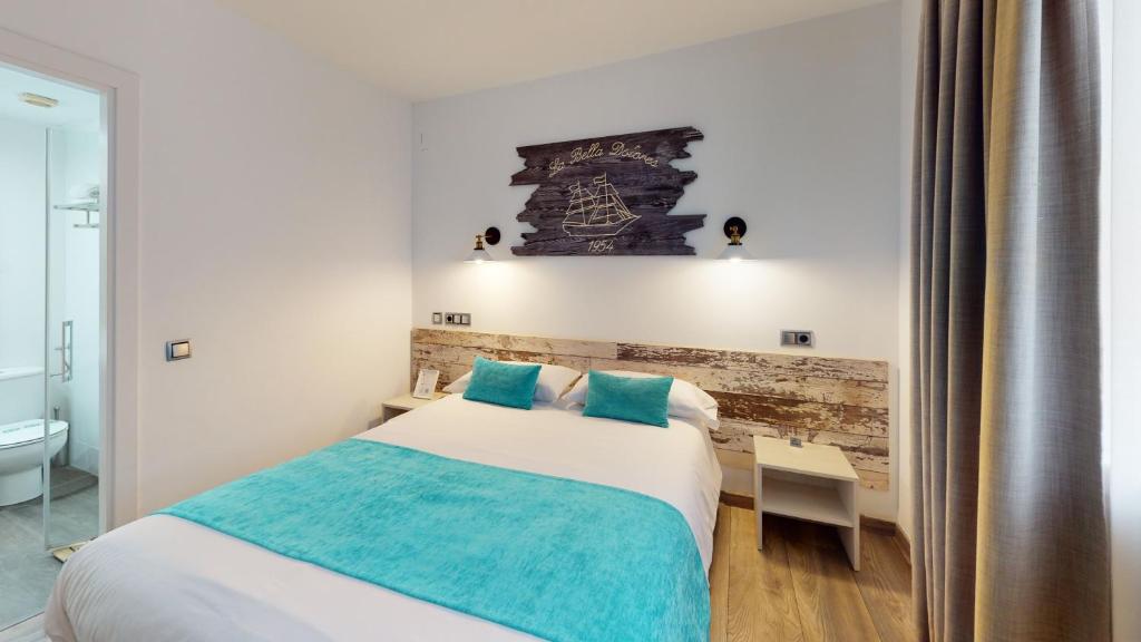 Posteľ alebo postele v izbe v ubytovaní Hotel Bella Dolores