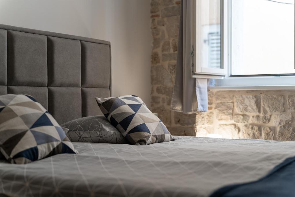 Postel nebo postele na pokoji v ubytování Apartments Casanova
