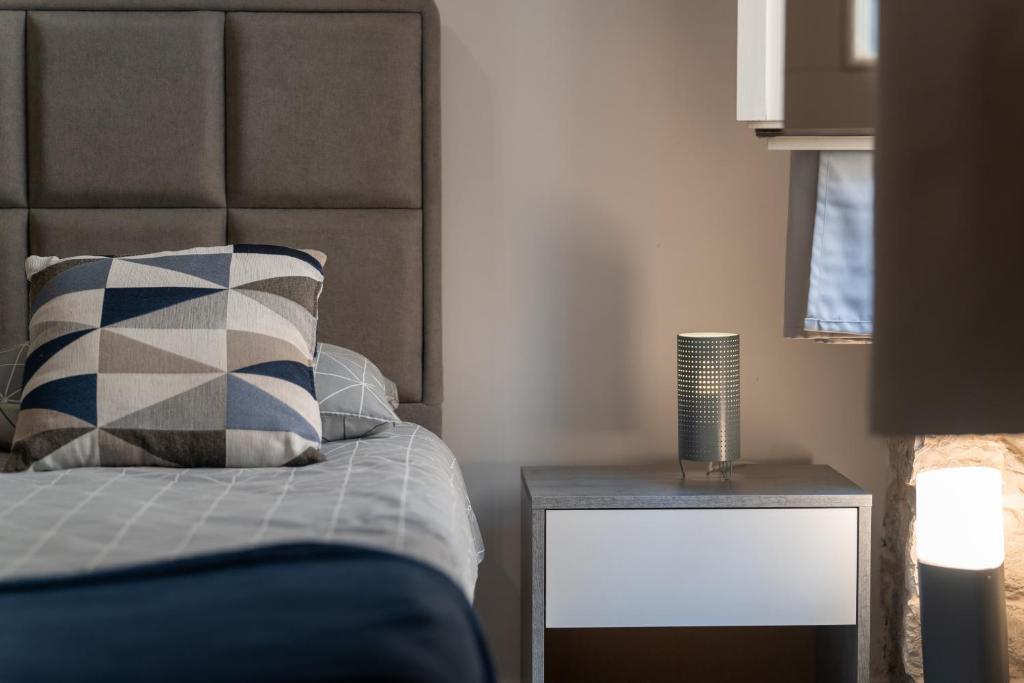 Postel nebo postele na pokoji v ubytování Apartments Casanova