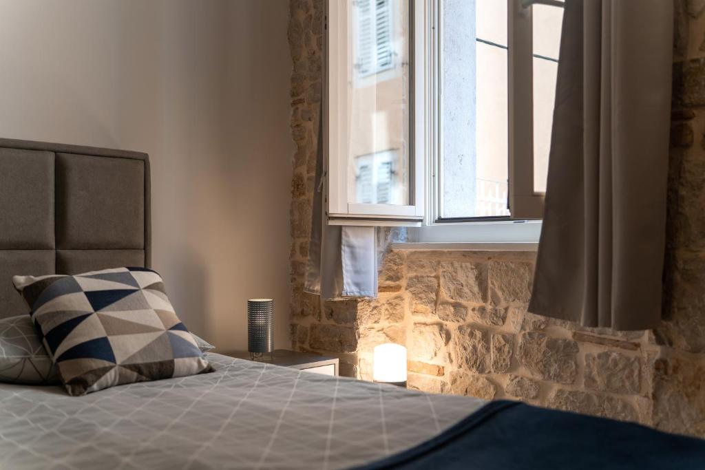 Postel nebo postele na pokoji v ubytování Apartments Casanova