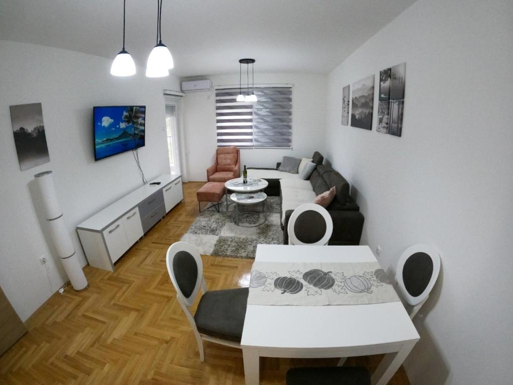 a living room with a couch and a table at Z&R SUNLIGHT in Trebinje