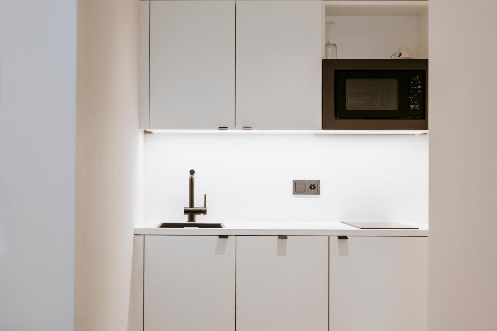 Η κουζίνα ή μικρή κουζίνα στο ART-INN Design Self-Check-in-Hotel
