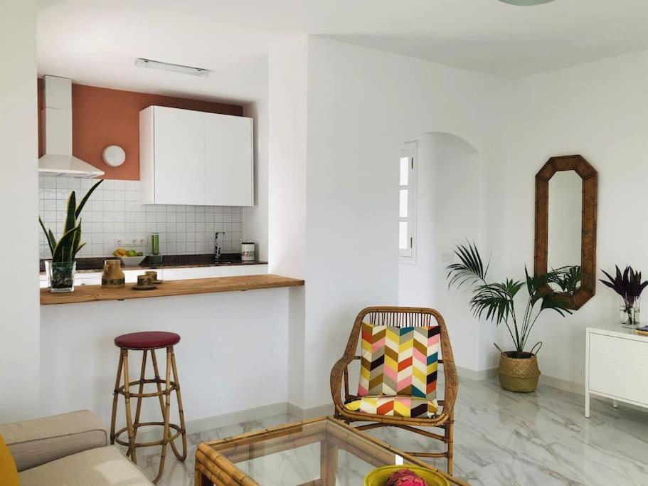 a living room with a chair and a table at Casa Nicolás in Playa Honda