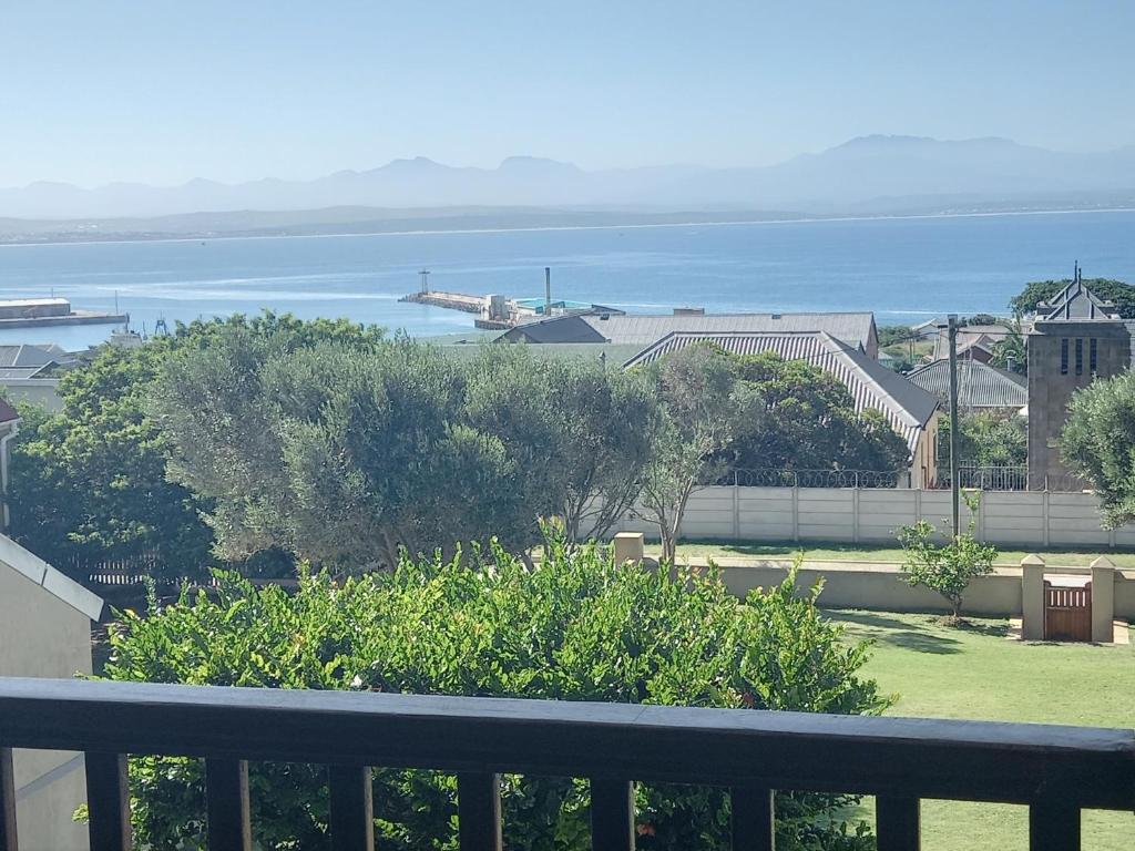 a view of the ocean from a balcony at Barmarine Luxury Holiday Home in Mossel Bay