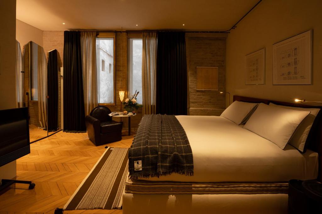 Postel nebo postele na pokoji v ubytování The Venice Venice Hotel