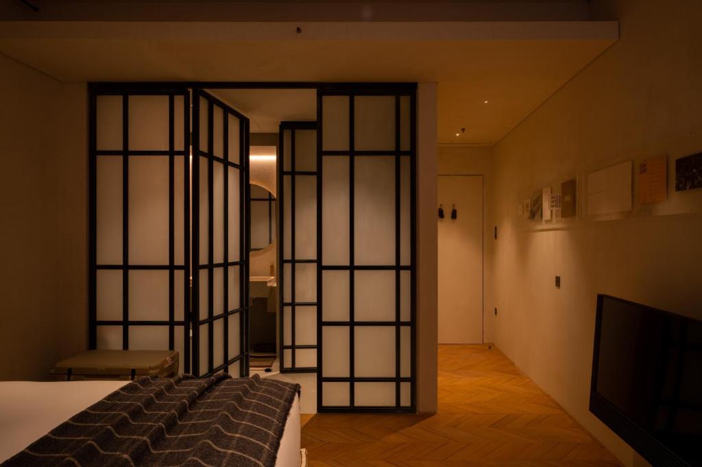 Postel nebo postele na pokoji v ubytování The Venice Venice Hotel