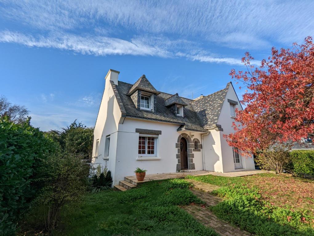 a white house with a gray roof at Charming House in the Cabellou on coastal trail in Concarneau
