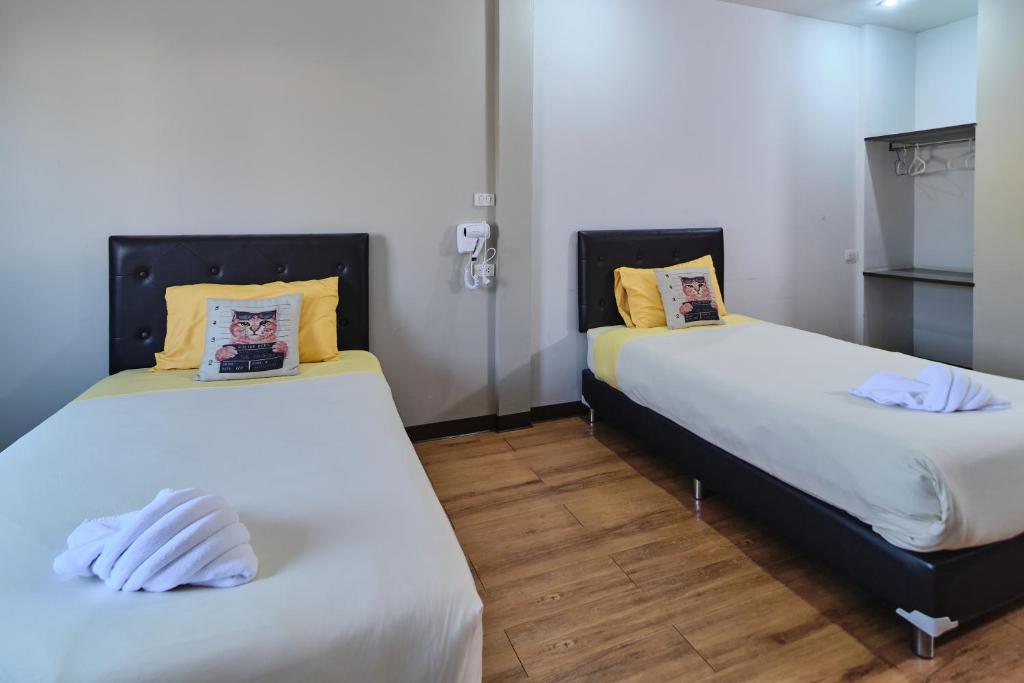 Postel nebo postele na pokoji v ubytování Bkk39 Airport hotel