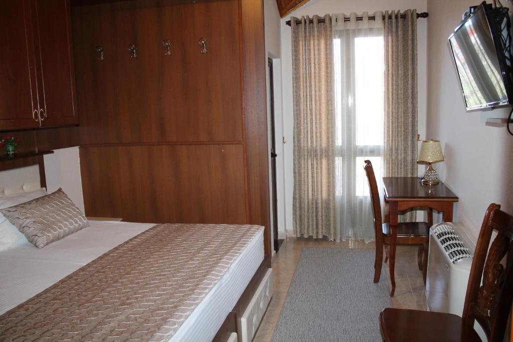 Postel nebo postele na pokoji v ubytování Hotel Hasmegaj