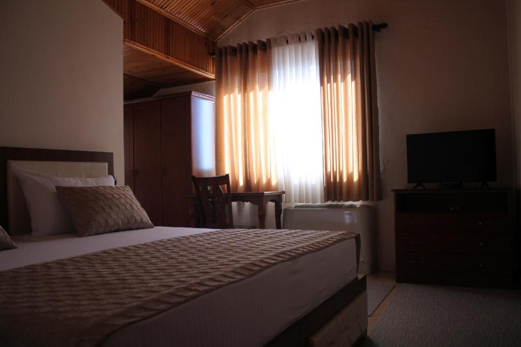 Postel nebo postele na pokoji v ubytování Hotel Hasmegaj