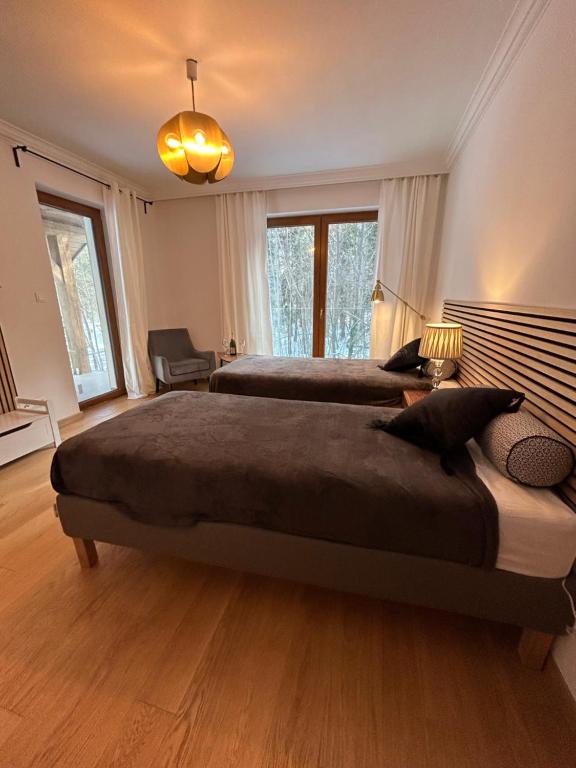 Postel nebo postele na pokoji v ubytování Leśna Residence & SPA