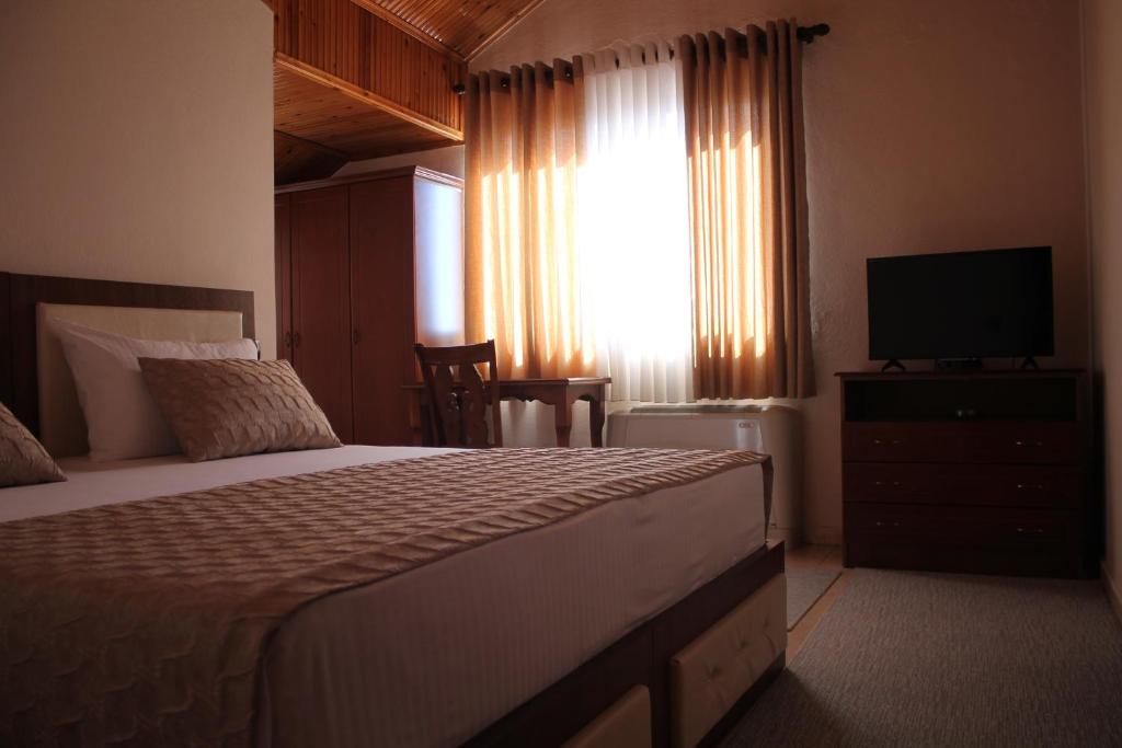 Postel nebo postele na pokoji v ubytování Hotel Hasmegaj