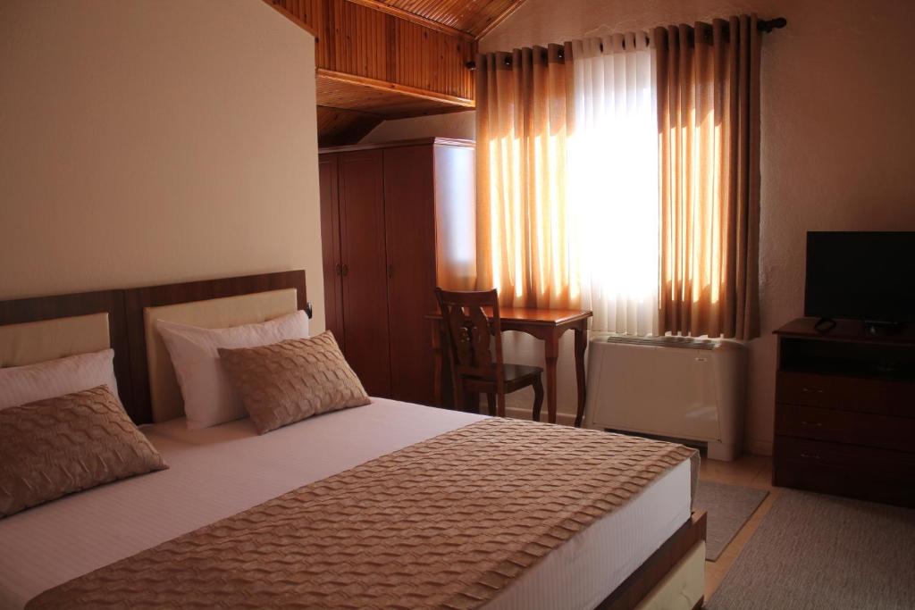 Postel nebo postele na pokoji v ubytování Hotel Hasmegaj