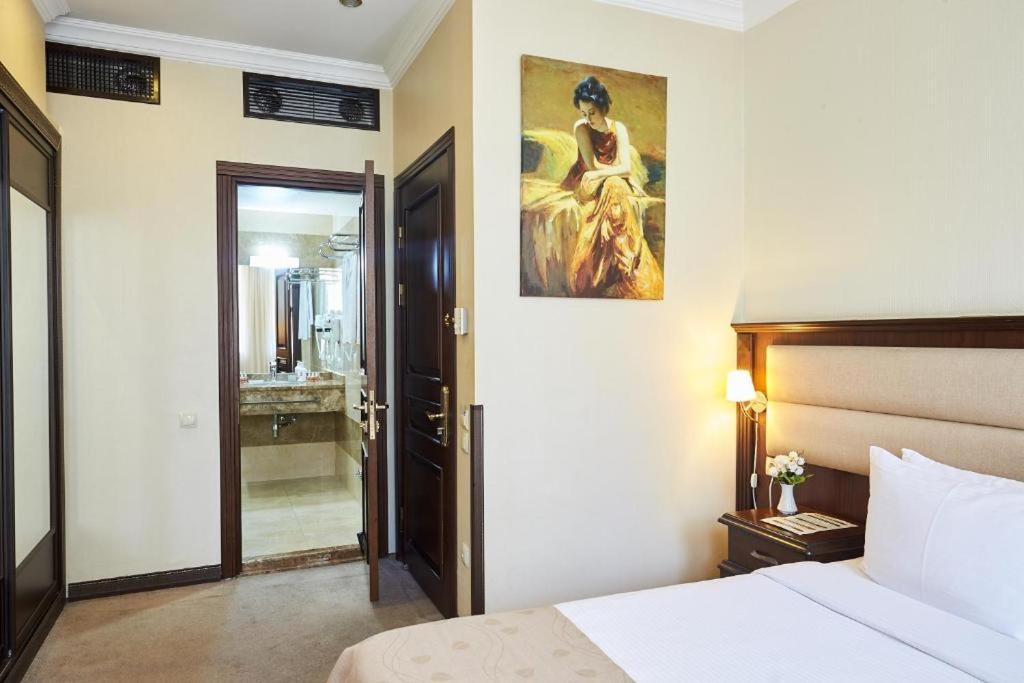 Postel nebo postele na pokoji v ubytování Smith Hotel