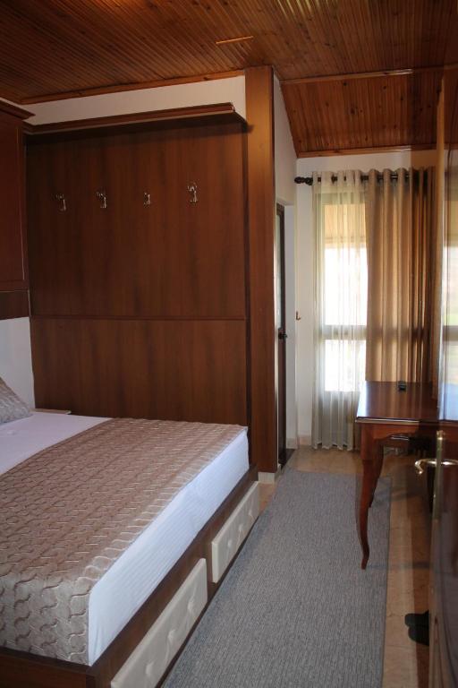 Postel nebo postele na pokoji v ubytování Hotel Hasmegaj