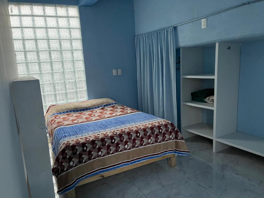 Кровать или кровати в номере Estudio amplio iluminado/terraza Coyoacán CU UNAM