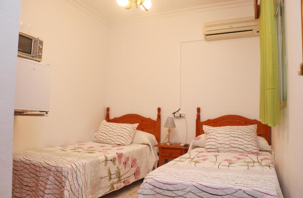 Postel nebo postele na pokoji v ubytování Habitación Calle Ancha 02
