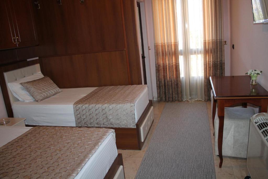 Postel nebo postele na pokoji v ubytování Hotel Hasmegaj