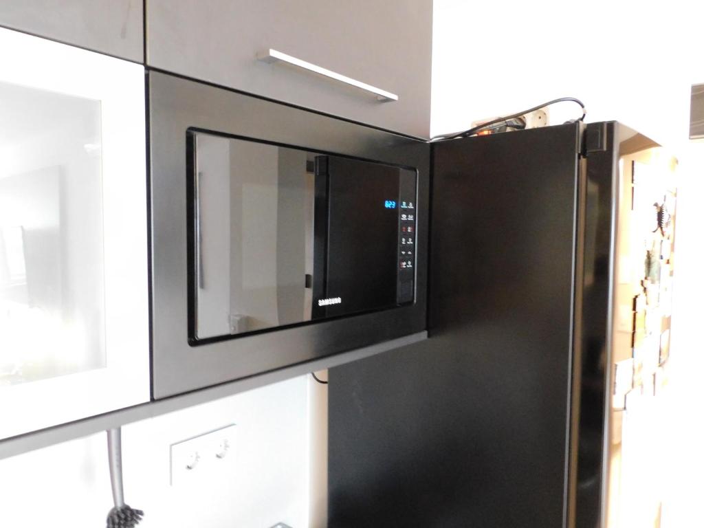 Kuchyň nebo kuchyňský kout v ubytování Chill & Relax Apartment