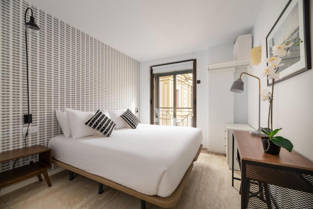Postel nebo postele na pokoji v ubytování Apartamentos Suite The Way