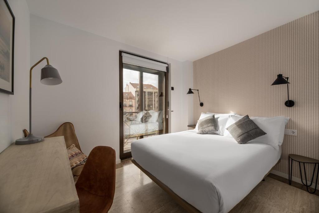 Postel nebo postele na pokoji v ubytování Apartamentos Suite The Way