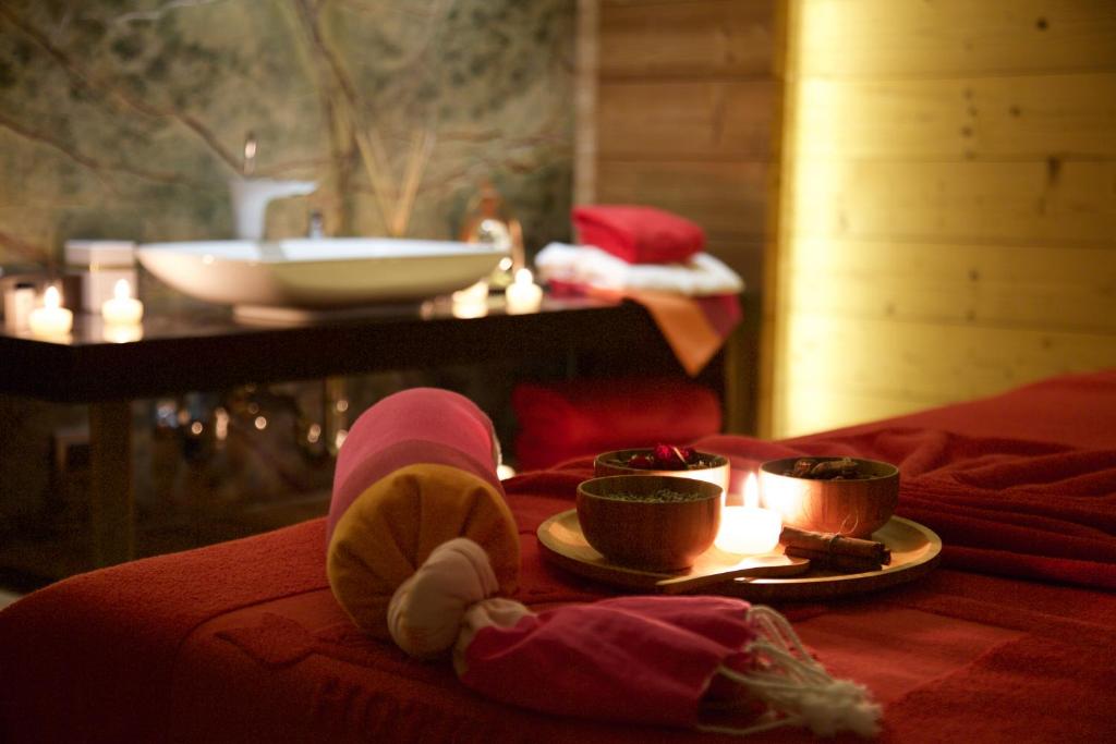 Cama ou camas em um quarto em Dosso Dossi Hotels & SPA Downtown