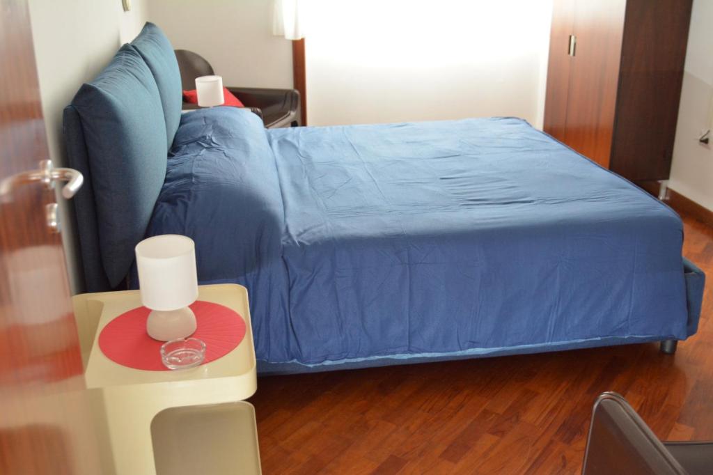 A bed or beds in a room at Casa D'Amato Salerno