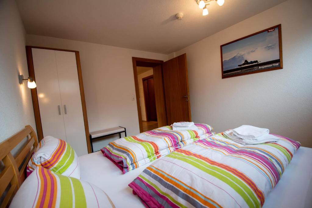 Postel nebo postele na pokoji v ubytování Haus Raggl
