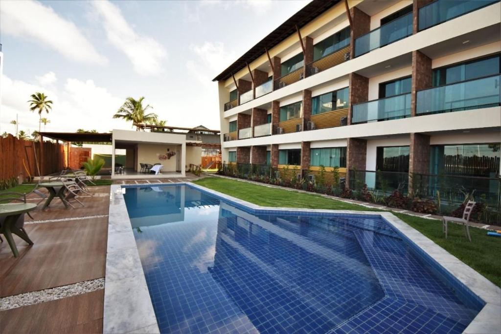 Kolam renang di atau dekat dengan Flats em Condominio Velas do Porto