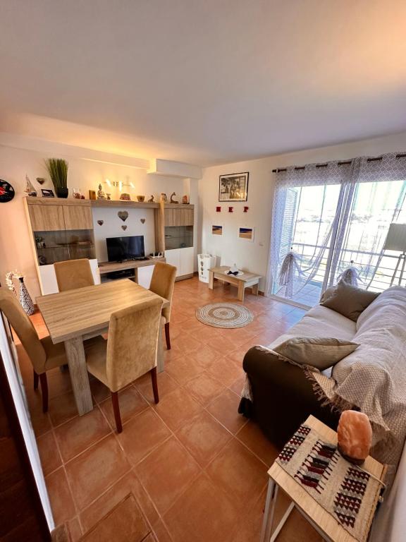 a living room with a couch and a table at La Casita in Costa de Antigua