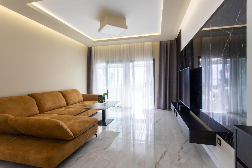 Televízia a/alebo spoločenská miestnosť v ubytovaní Holiday apartment Capeta