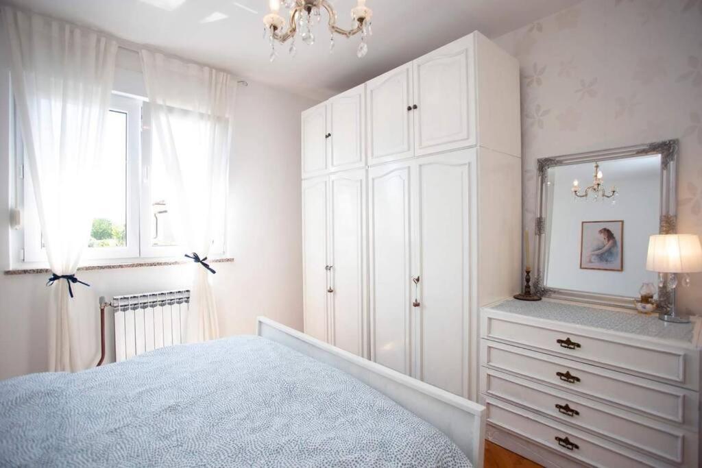 Posteľ alebo postele v izbe v ubytovaní Apartments Villa Leylandia