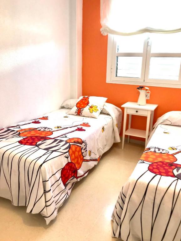 A bed or beds in a room at Apartamento DUPLEX CRUZ DEL MAR