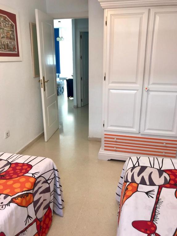 A bed or beds in a room at Apartamento DUPLEX CRUZ DEL MAR
