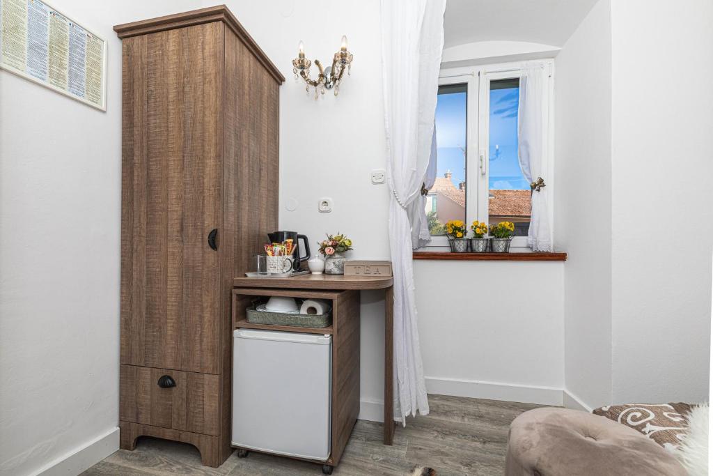 Kuchyň nebo kuchyňský kout v ubytování Rooms Tomic