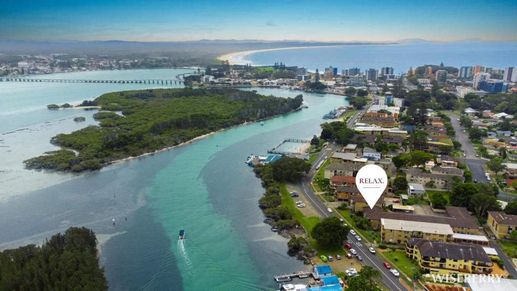 an aerial view of a river and a city at Wallis View 3 in Forster