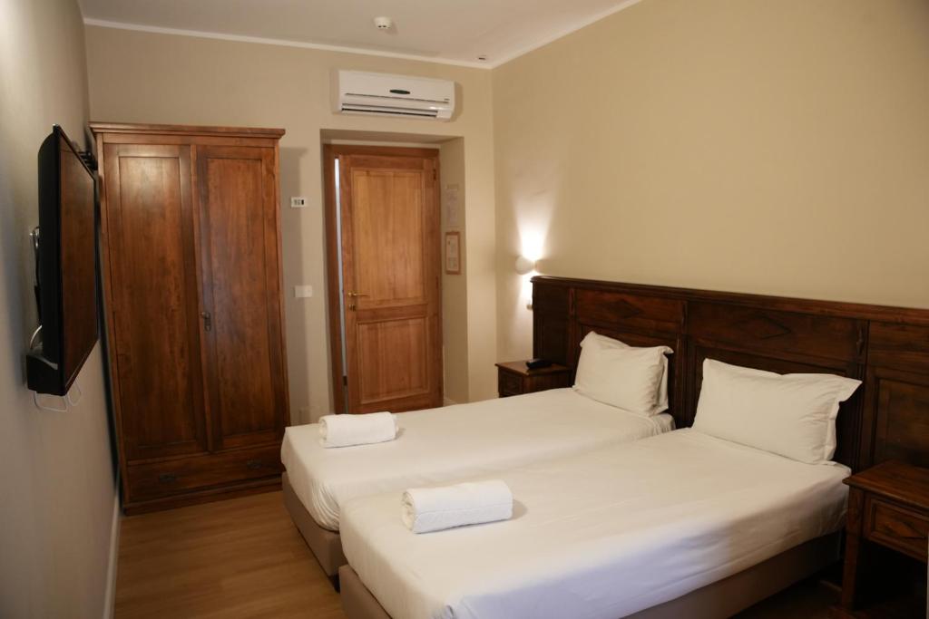 Postel nebo postele na pokoji v ubytování Hotel Montevecchio